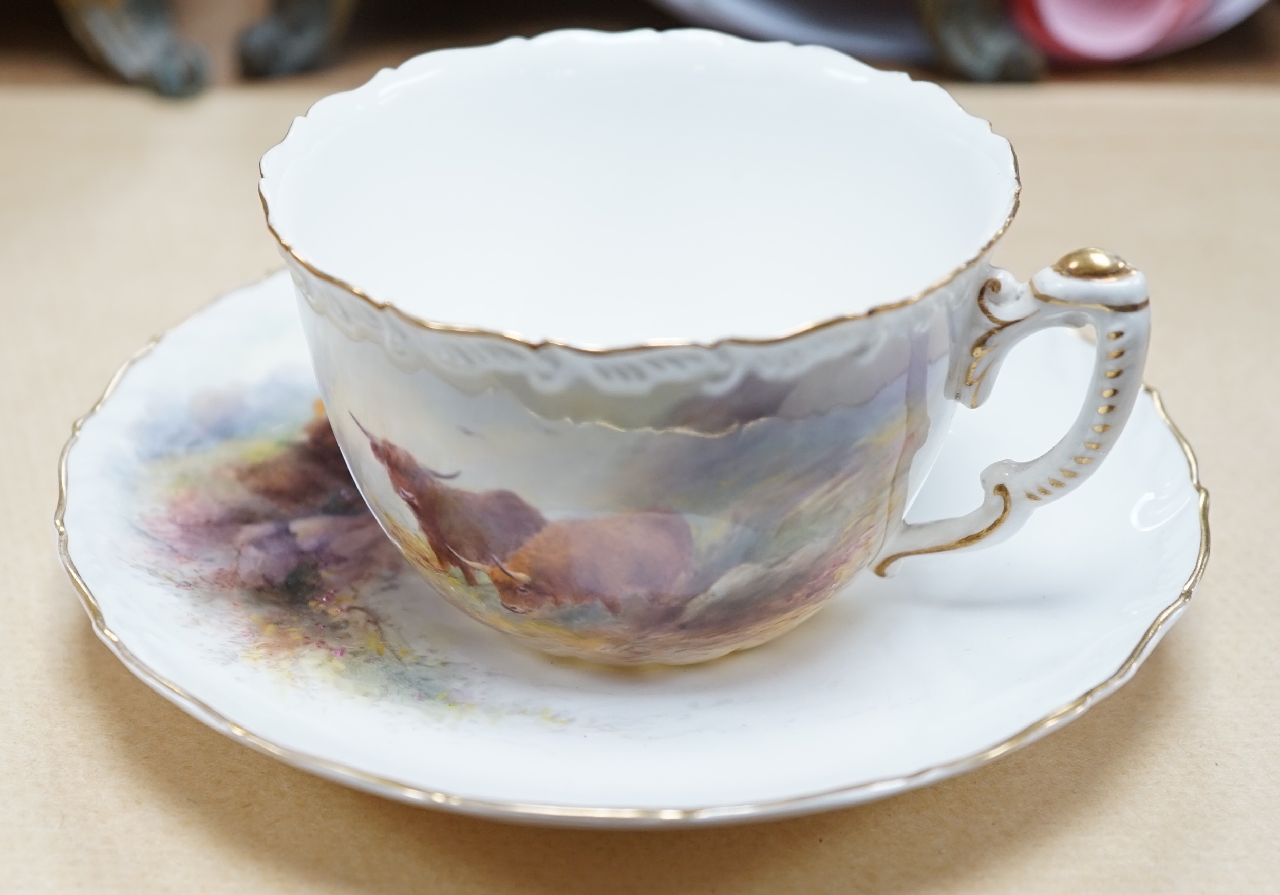 A Royal Worcester Harry Stinton Highland cattle painted cup and saucer, saucer 13cm diameter. Condition - good